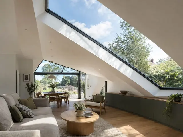 Bespoke angled glass rooflight following a sloping ceiling